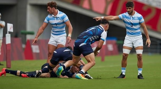 Rodrgo Isgro of Argentina, Kun Kyu Han of South Korea and German Schulz of Argentina battle for the ball during the Rugby Pool A match between...