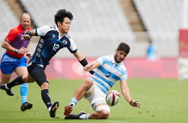 Yeon Sik Jeong of South Korea and German Schulz of Argentina battle for the ball during the Rugby Pool A match between Argentina and Republic of...