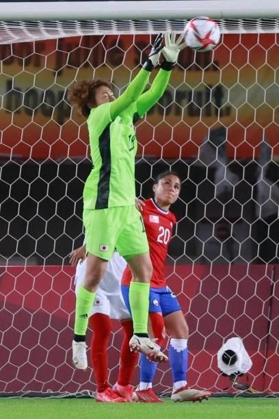Japan's goalkeeper Ayaka Yamashita makes a save during the Tokyo 2020 Olympic Games women's group E first round football match between Chile and...