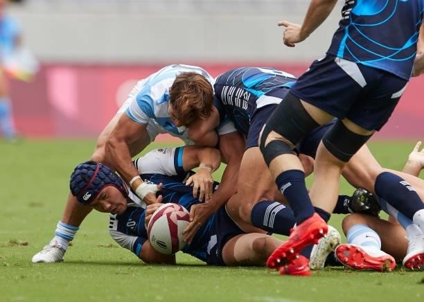 Players of South Korea and Argentina battle for the ball during the Rugby Pool A match between Argentina and Republic of Korea on day four of the...