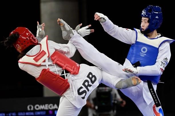 South Korea's Lee Da-bin and Serbia's Milica Mandic compete in the taekwondo women's +67kg gold medal bout during the Tokyo 2020 Olympic Games at the...