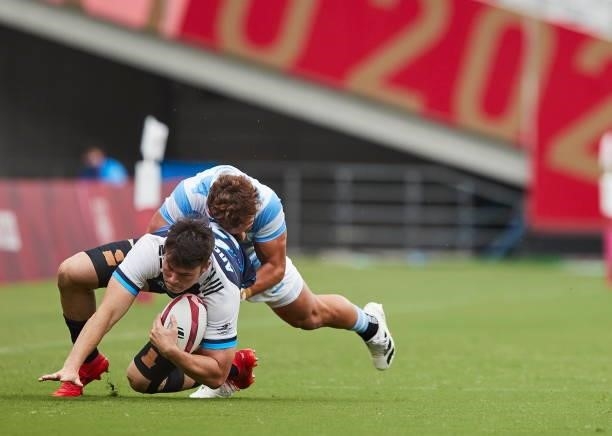 Andre Jin Coquillard of South Korea battle for the ball during the Rugby Pool A match between Argentina and Republic of Korea on day four of the...