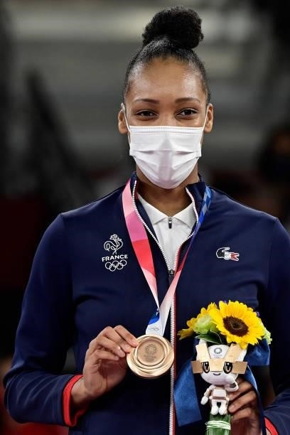 Bronze medalist France's Althea Laurin poses on the podium after the taekwondo women's +67kg bronze medal A bout during the Tokyo 2020 Olympic Games...