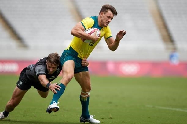 Lachlan Anderson of Australia and Tim Mikkelson of New Zealand battle for the ball during the Rugby Pool A match between New Zealand and Australia on...