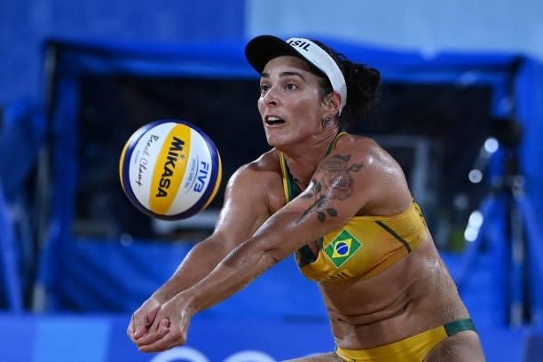 Brazil's Agatha Bednarczuk hits the ball in their women's preliminary beach volleyball pool C match between Brazil and China during the Tokyo 2020...