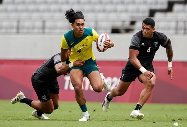 Dietrich Peter Roache of Australia battle for the ball during the Rugby Pool A match between New Zealand and Australia on day four of the Tokyo 2020...