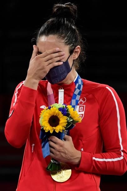 Gold medalist Serbia's Milica Mandic poses on the podium after the taekwondo women's +67kg bronze medal A bout during the Tokyo 2020 Olympic Games at...