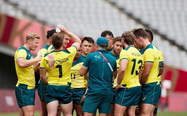 Players of Australia form a circle after the match during the Rugby Pool A match between New Zealand and Australia on day four of the Tokyo 2020...