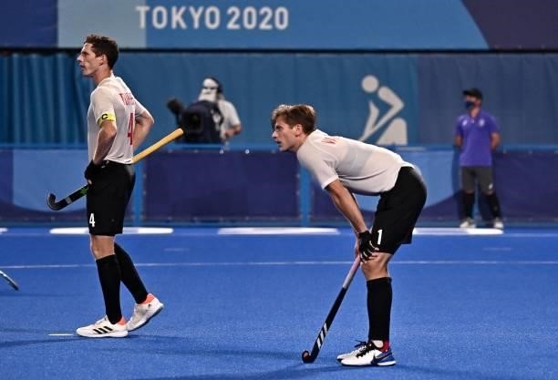 Canada's Scott William Martin Tupper and Floris Frederik Van Son react after Netherlands scored a goal during the men's pool B match of the Tokyo...
