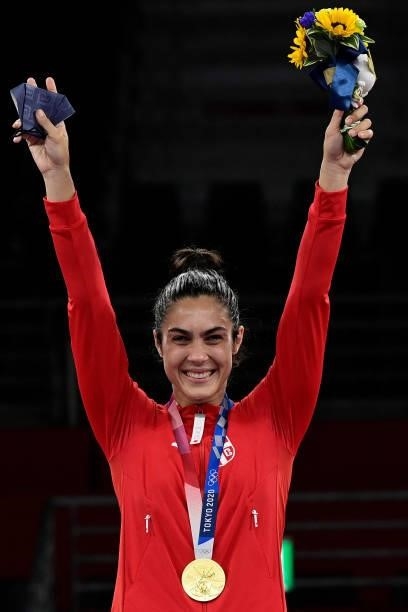 Gold medalist Serbia's Milica Mandic poses on the podium after the taekwondo women's +67kg bronze medal A bout during the Tokyo 2020 Olympic Games at...