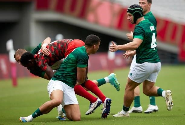 Player of Kenya and Players of Ireland battle for the ball during the Rugby Pool c match between Kenya and Ireland on day four of the Tokyo 2020...