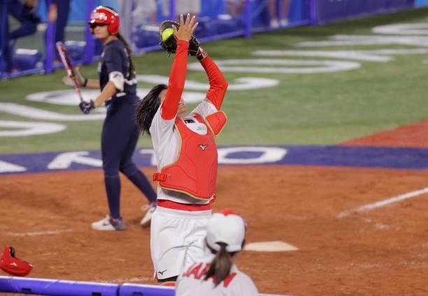 Japan's catcher Haruka Agatsuma catches a pop fly ball in a foul territory to get a final out of a gold medal win during the seventh inning of the...