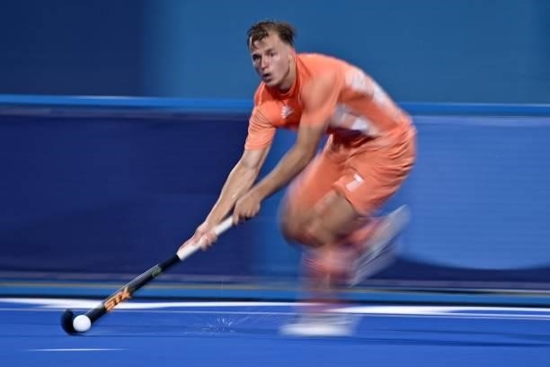 Netherlands' Thijs Johannes Reinier Van Dam carries the ball during their men's pool B match of the Tokyo 2020 Olympic Games field hockey competition...