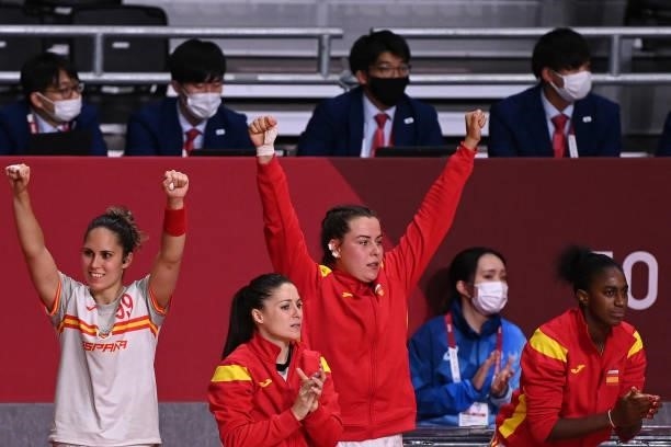 Spain's players react on the sideline during the women's preliminary round group B handball match between France and Spain of the Tokyo 2020 Olympic...