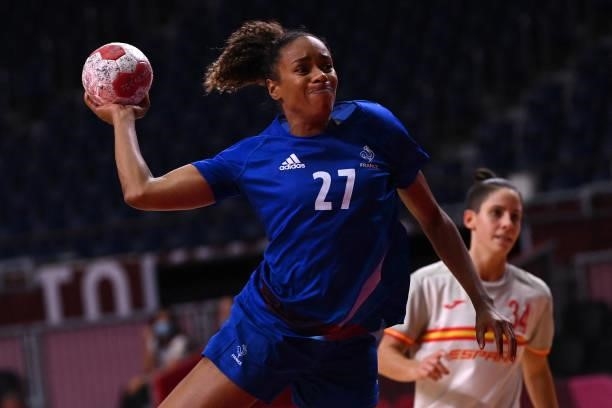 France's left back Estelle Nze Minko shoots during the women's preliminary round group B handball match between France and Spain of the Tokyo 2020...