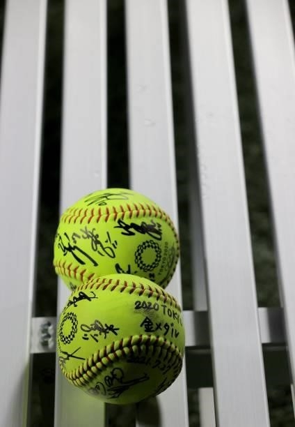 Gold medal winning Japan team's sign balls are placed on a bench after the medal ceremony for the softball competition in the Tokyo 2020 Olympic...