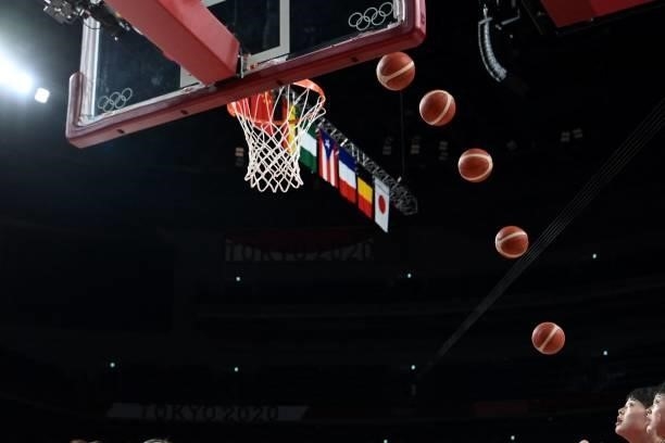 This miltiple exposure picture shows a Chinese player shooting the ball in the women's preliminary round group C basketball match between China and...