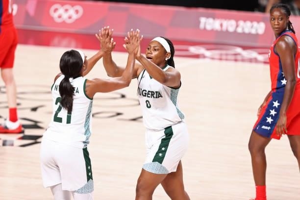 Antonye Nyingifa of the Nigeria Womens National Team high fives Amy Okonkwo during the game against the USA Basketball Womens National Team during...