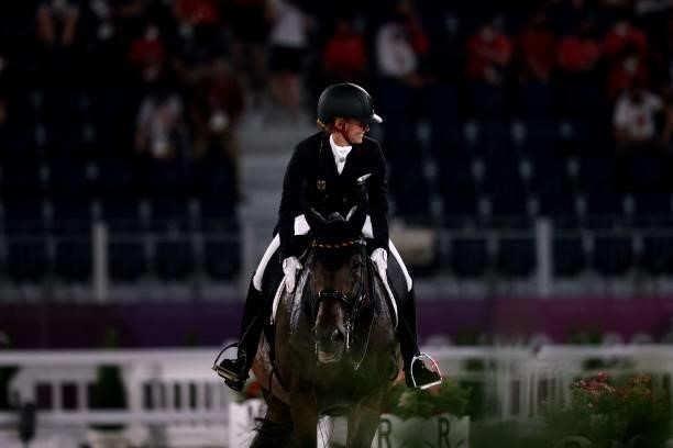 Germany's Jessica von Bredow-Werndl riding TSF Dalera smiles after competing in the dressage grand prix special team competition during the Tokyo...