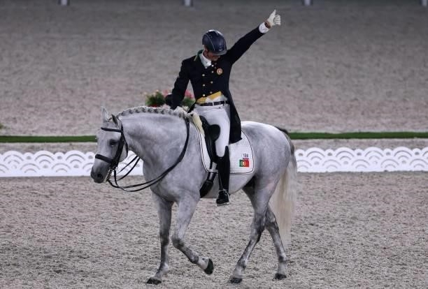 Portugal's Rodrigo Torres riding Fogoso reacts after competing in the dressage grand prix special team competition during the Tokyo 2020 Olympic...