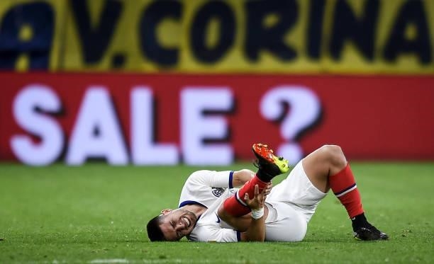 Matias Palacios of San Lorenzo reacts after being injured during a match between Boca Juniors and San Lorenzo as part of Torneo Liga Profesional 2021...