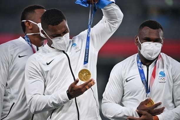 Fiji player looks at his gold medal during the victory ceremony after the men's final rugby sevens match during the Tokyo 2020 Olympic Games at the...