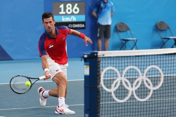 Serbia's Novak Djokovic returns the ball to Spain's Alejandro Davidovich Fokina during their Tokyo 2020 Olympic Games men's singles third round...