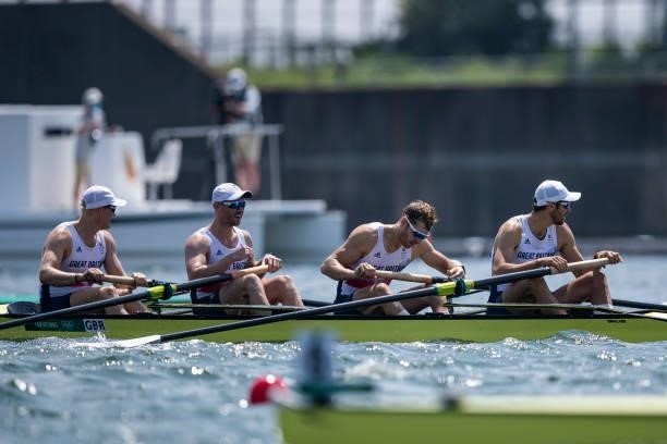 Oliver Cook of Great Britain, Matthew Rossiter of Great Britain, Rory Gibbs of Great Britain and Sholto Carnegie of Great Britain lie in the water...