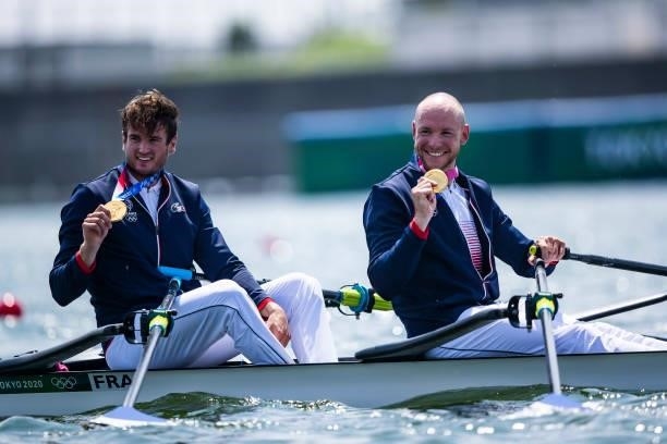 Hugo Boucheron of France and Matthieu Androdias of France lie in the water during the men's semi-final in the lightweight double sculls during Rowing...
