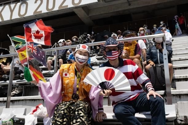 Olympic super-fan Kyoko Ishikawa and her husband John Sledge pose for a picture at the spectator stands of the Fuji International Speedway in...