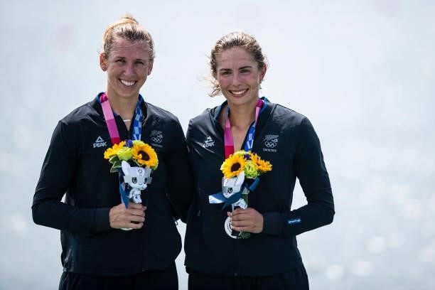 Brooke Donoghue of New Zealand and Hannah Osborne of New Zealand lie in the water during the men's semi-final in the lightweight double sculls during...