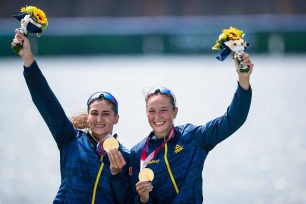 Ancuta Bodnar of Romania and Simona Radis of Romania lie in the water during the men's semi-final in the lightweight double sculls during Rowing on...