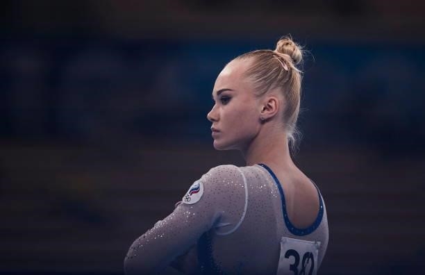Angela Melnikova of Russian Olympic Commite looks on during the women's team final on the uneven bars during Artistic Gymnastics on day four of the...