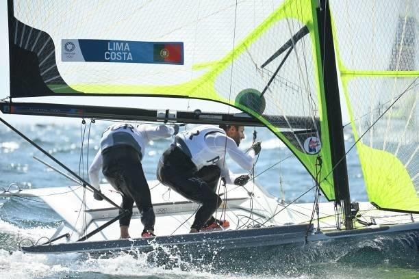 Portugal's José Costa and Jorge Lima compete in the men's skiff 49er race during the Tokyo 2020 Olympic Games sailing competition at the Enoshima...