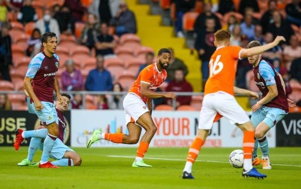 Blackpool's CJ Hamilton plays a ball to Sonny Carey during the Pre-Season Friendly match between Blackpool and Burnley at Bloomfield Road on July 27,...