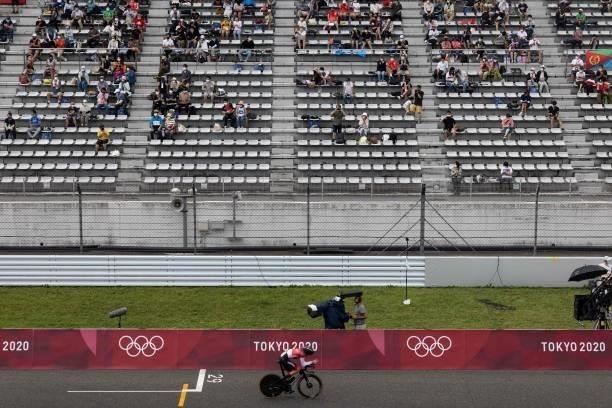 Spectators watch the men's cycling road individual time trial during the Tokyo 2020 Olympic Games at the Fuji International Speedway in Oyama,...