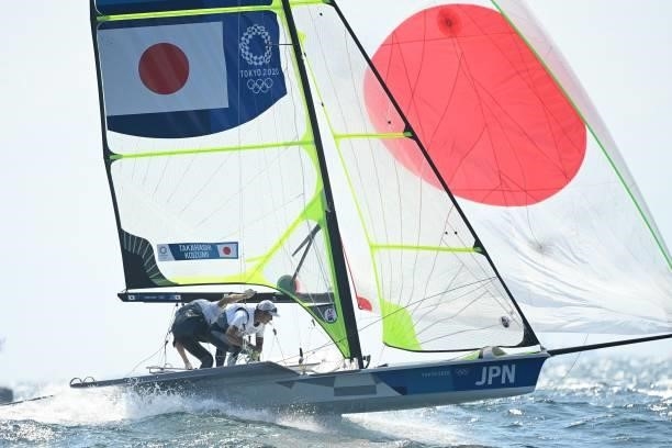 Japan's Ibuki Koizumi and Leo Takahashi compete in the men's skiff 49er race during the Tokyo 2020 Olympic Games sailing competition at the Enoshima...