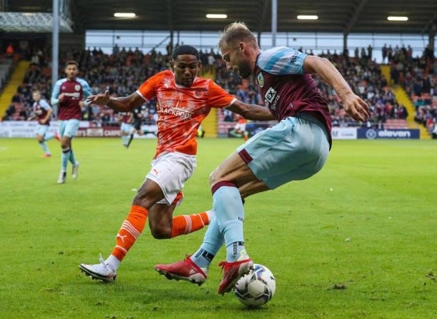 Burnley's Charlie Taylor battles with Blackpool's Demi Mitchell during the Pre-Season Friendly match between Blackpool and Burnley at Bloomfield Road...