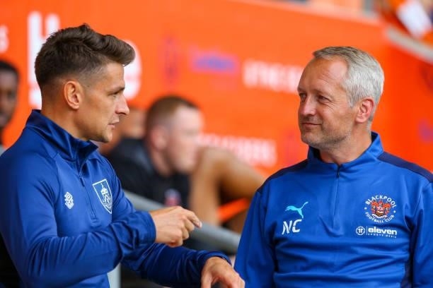 Blackpool manager Neil Critchley talks to Burnley's Ashley Westwood before the game during the Pre-Season Friendly match between Blackpool and...
