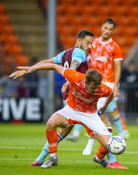 Blackpool's Callum Connolly shields the ball from Burnley's Josh Brownhill during the Pre-Season Friendly match between Blackpool and Burnley at...