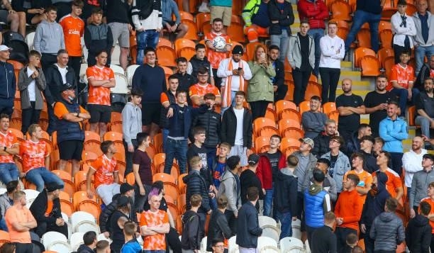 Blackpool fans watch on during the Pre-Season Friendly match between Blackpool and Burnley at Bloomfield Road on July 27, 2021 in Blackpool, England.