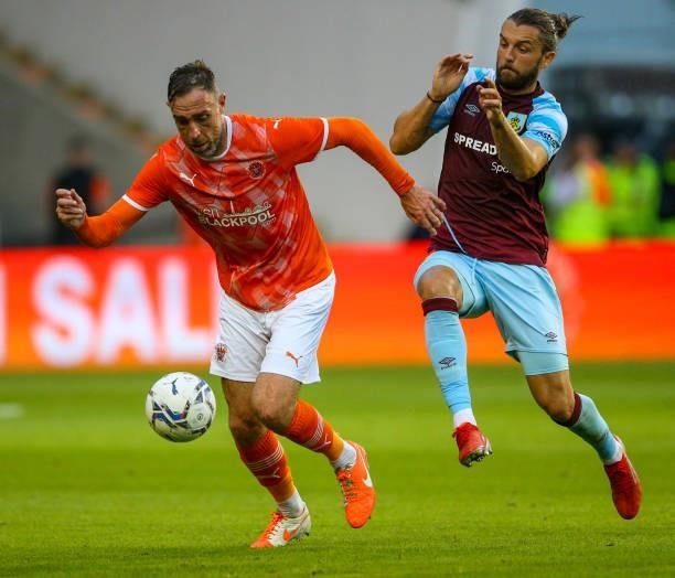 Blackpool's Richard Keogh vies for possession with Burnley's Jay Rodriguez during the Pre-Season Friendly match between Blackpool and Burnley at...