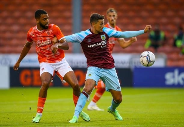 Burnley's Matthew Lowton shields the ball from Blackpool's CJ Hamilton during the Pre-Season Friendly match between Blackpool and Burnley at...