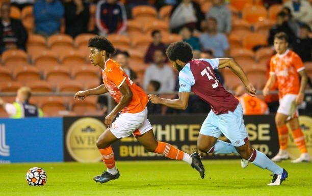 Blackpool's Tayt Trusty gets away from Burnley's Richard Nartey during the Pre-Season Friendly match between Blackpool and Burnley at Bloomfield Road...
