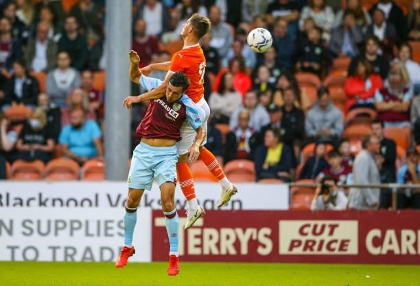Blackpool's Jerry Yates battles with Burnley's Jack Cork during the Pre-Season Friendly match between Blackpool and Burnley at Bloomfield Road on...