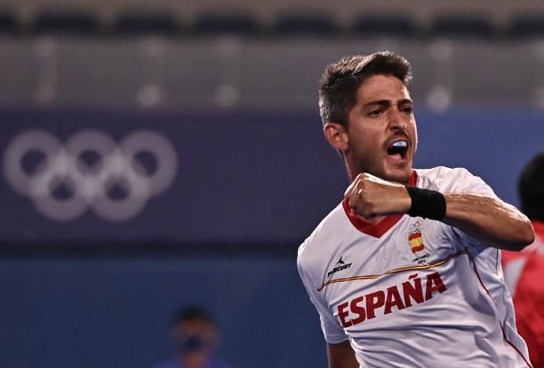Spain's Xavier Lleonart celebrates after scoring against Japan during their men's pool A match of the Tokyo 2020 Olympic Games field hockey...