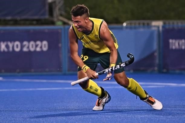 Australia's Tim Brand celebrates after scoring against New Zealand during their men's pool A match of the Tokyo 2020 Olympic Games field hockey...