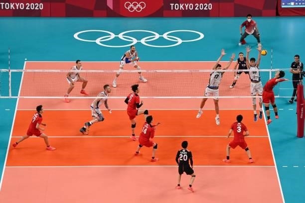 Japan's Yuji Nishida hits the ball in the men's preliminary round pool A volleyball match between Japan and Italy during the Tokyo 2020 Olympic Games...
