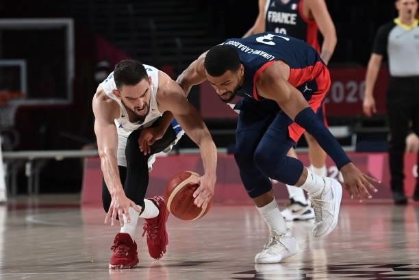 Czech Republic's Tomas Satoransky and France's Timothe Luwawu Kongbo fight for the ball in the men's preliminary round group A basketball match...