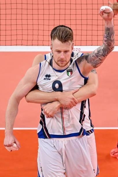 Italy's Ivan Zaytsev reacts after a point in the men's preliminary round pool A volleyball match between Japan and Italy during the Tokyo 2020...